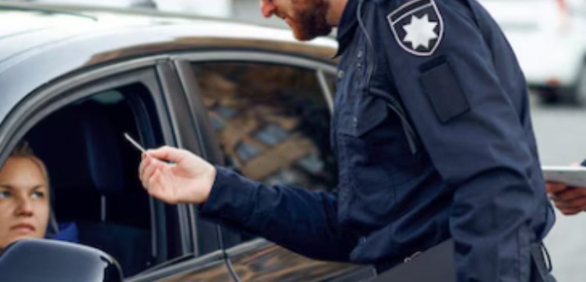 male police officers checking the driver's license
